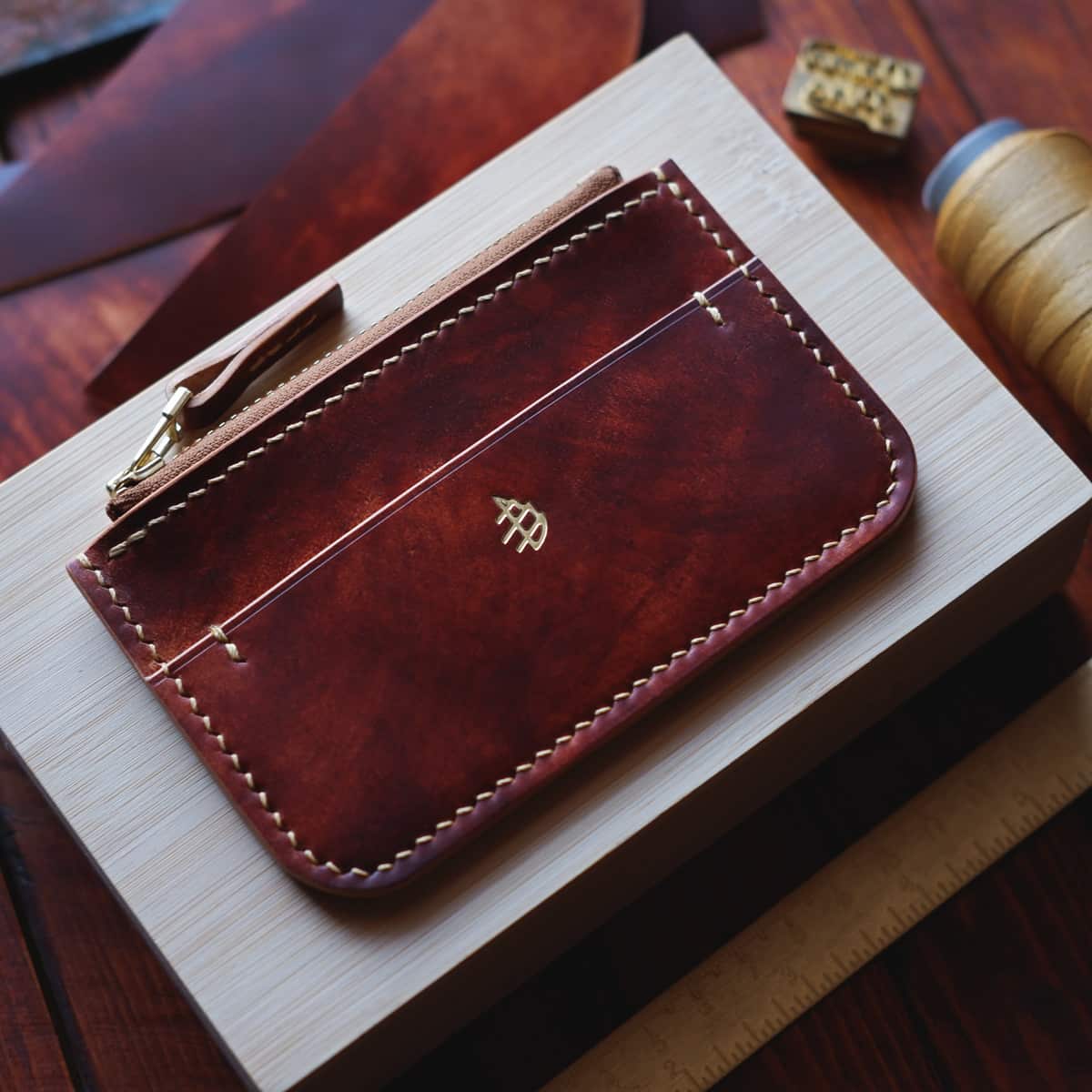 Tabletop view of The Coulter Zipper Wallet in premium Cognac Marbled Shell Cordovan horse leather