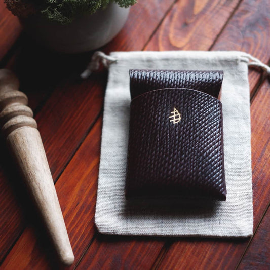 Tabletop view of The Mini Lodgepole Stitchless Wallet in Cognac Metta Catharina Shell leather