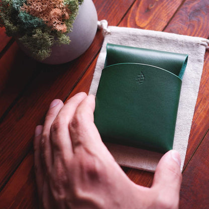 The Lodgepole Stitchless Wallet in Green Buttero leather tabletop view