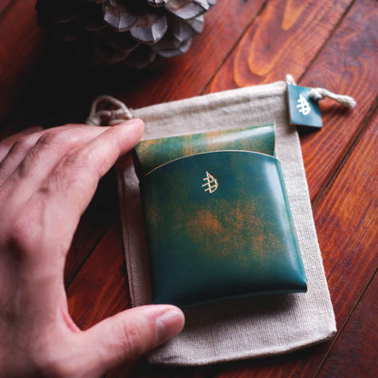 Tabletop view of The Lodgepole Stitchless Wallet in Turchese Marbled Shell Cordovan leather by Rocado tannery