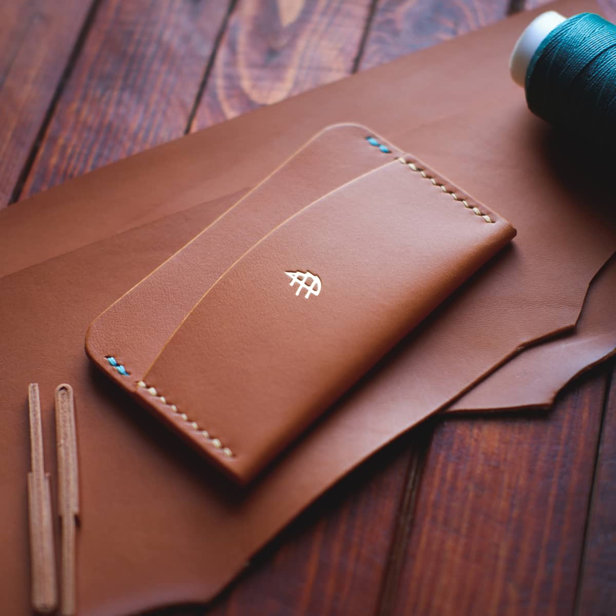 Tabletop view of The Mountain Card Holder in light brown aniline vegetable tanned leather