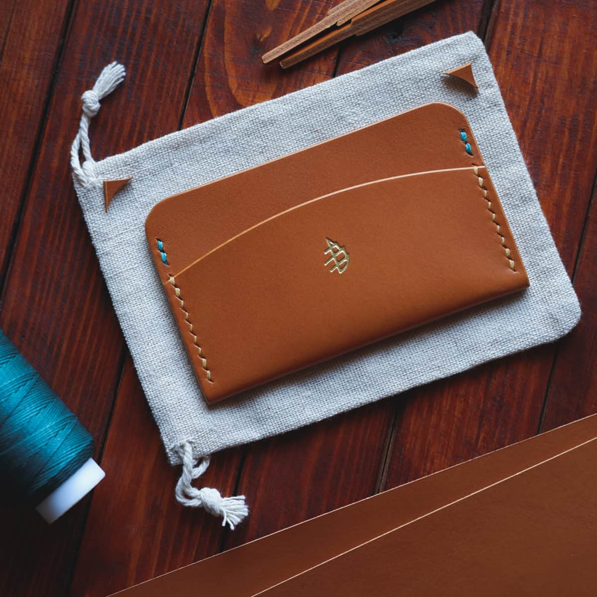 Tabletop view of The Mountain Card Holder in light brown aniline vegetable tanned leather