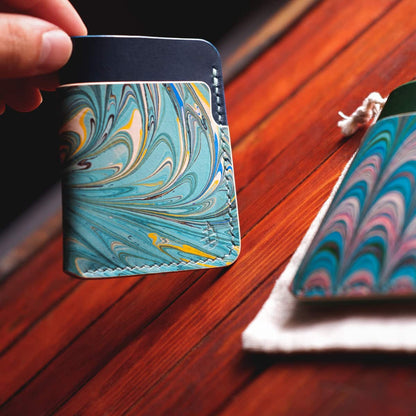 Closeup of The Vertical Card Holder in Blue Buttero and hand dyed marbled vegetable tanned leather