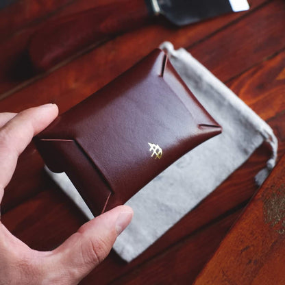 The Jack Stitchless Wallet in Firenze Lux leather held in hand - back side