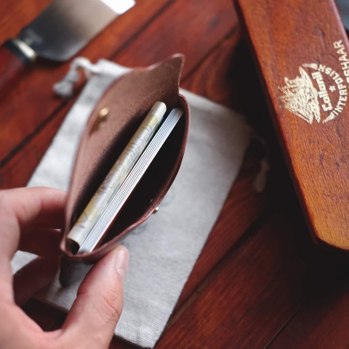 The Jack Stitchless Wallet in Firenze Lux leather interior view with credit cards and banknotes