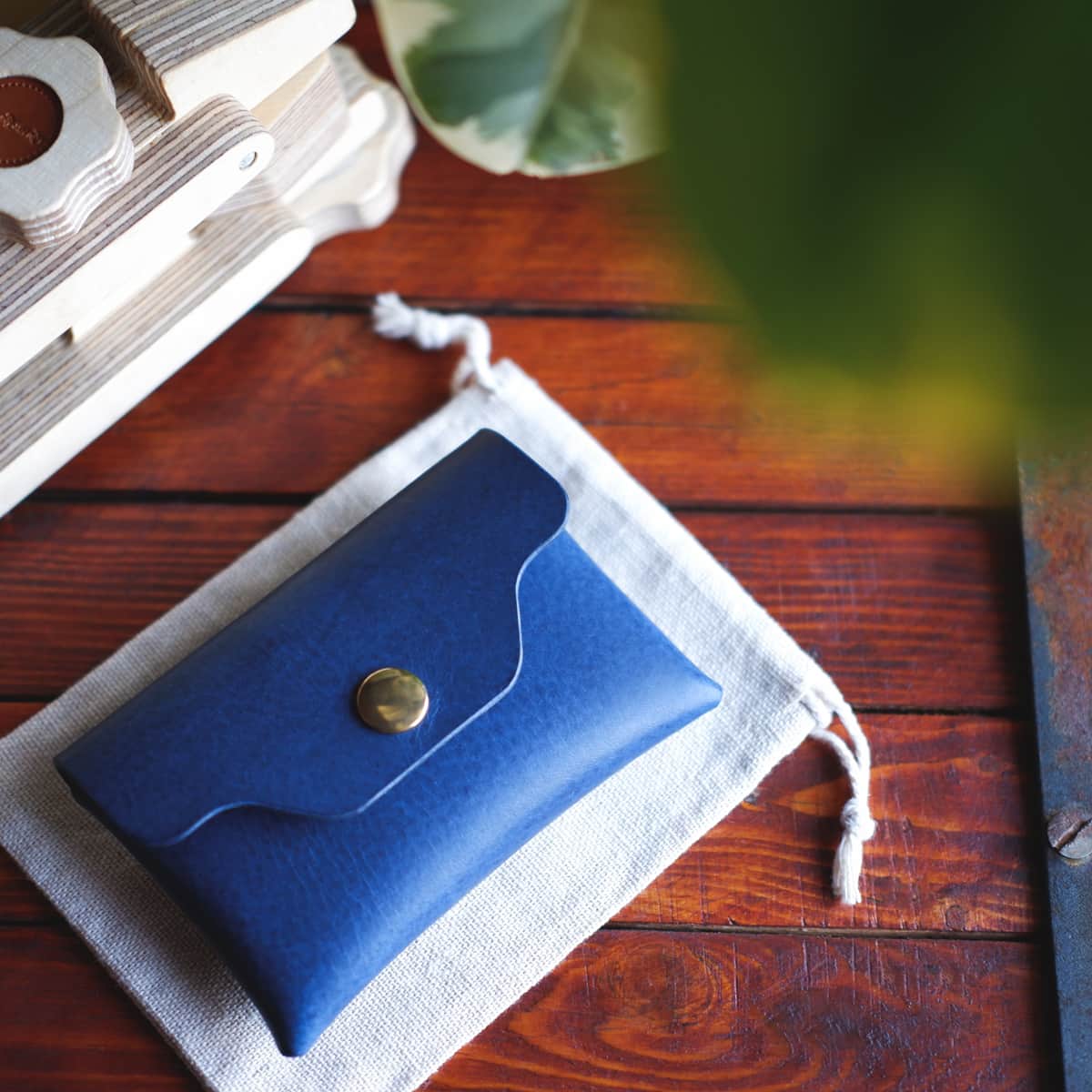Tabletop view of The Jack Stitchless Wallet in Cobalt Blue Vachetta leather