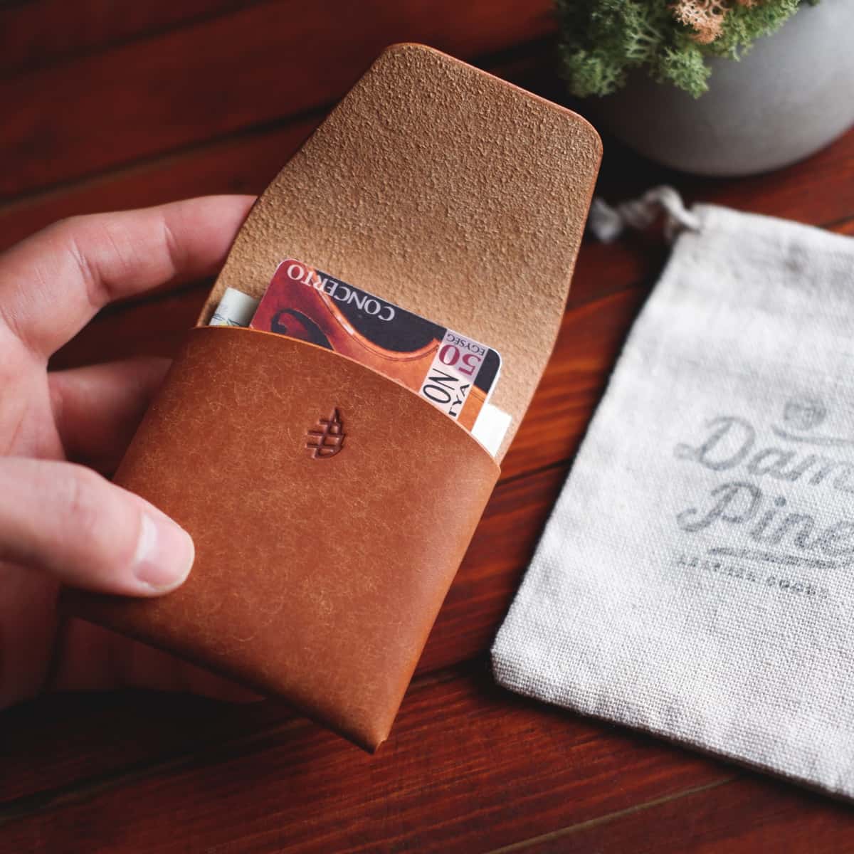 The Lodgepole Stitchless Wallet in Cognac Pueblo leather - interior with cards and cash