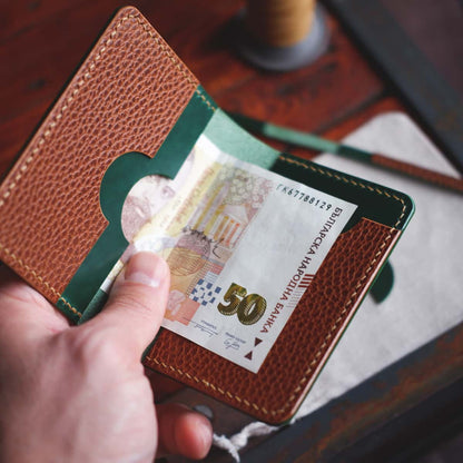 Interior view of the The Monterey 4-Slot Bifold wallet in Dollaro and Emerald Green Gaucho Oil leather