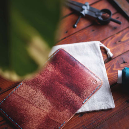 Tabletop view of The Monterey Slim Bifold wallet in Mogano Appaloosa leather