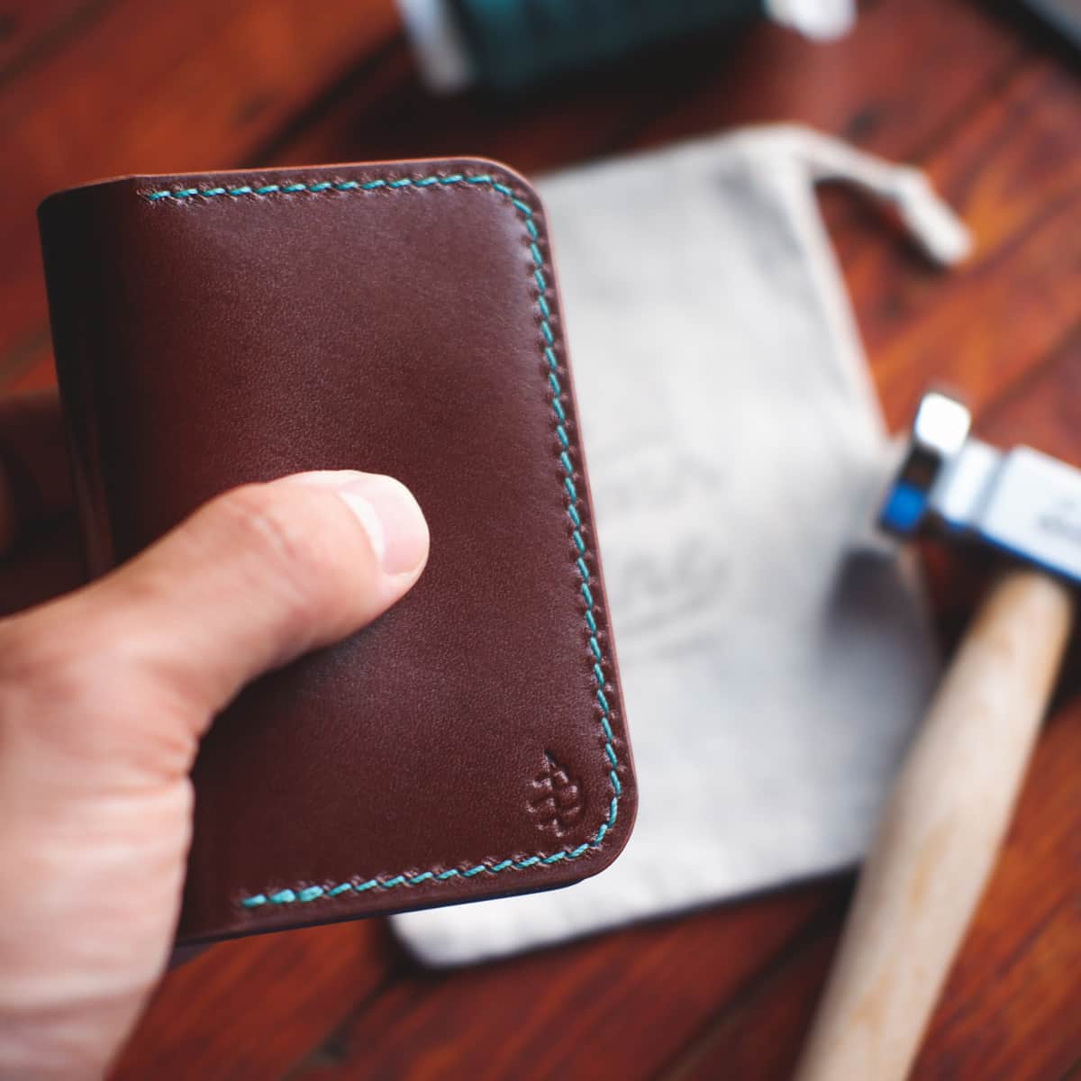 The Monterey Slim Bifold in Firenze Lux vegetable tanned leather held in hand