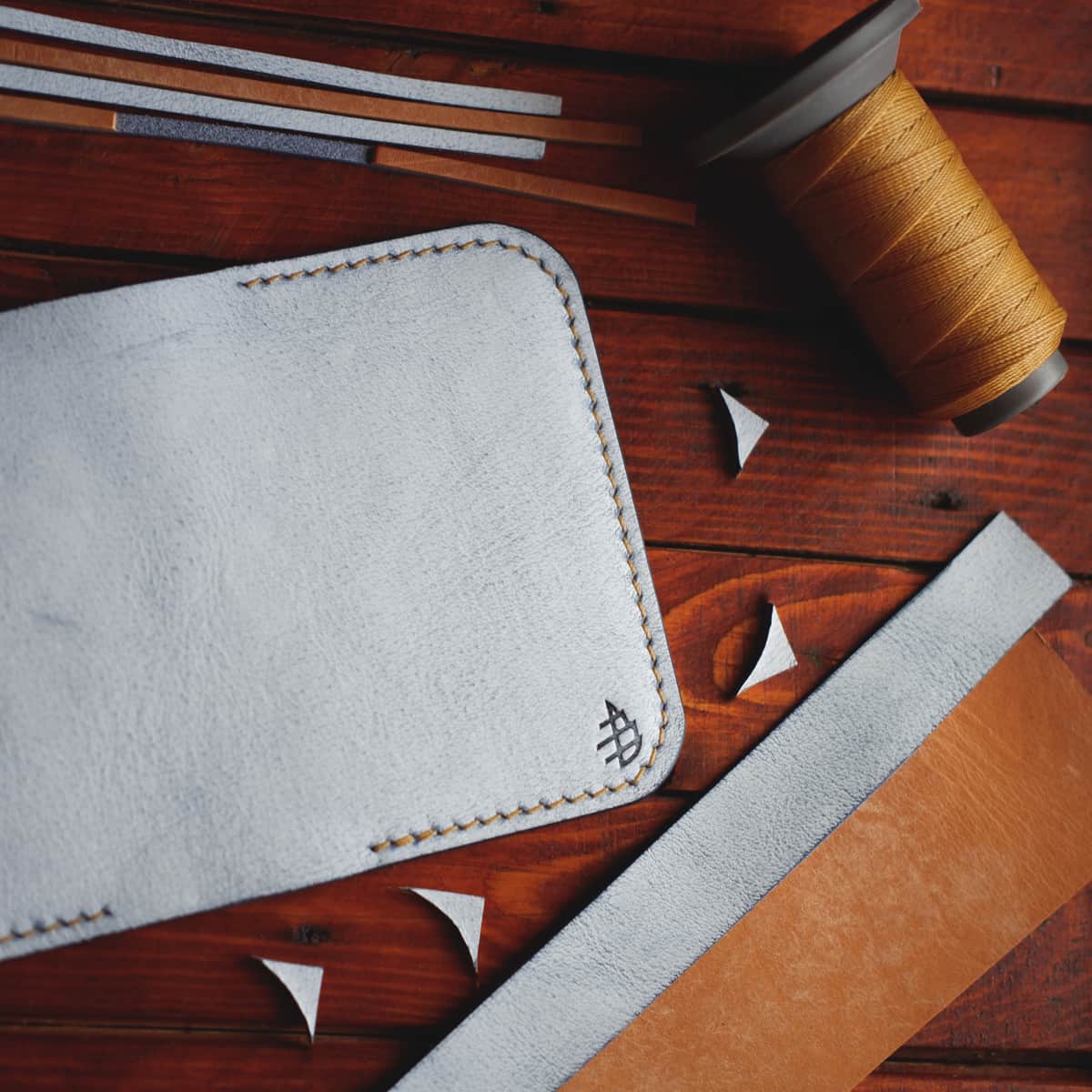Tabletop view of The Monterey Slim Bifold in Snow and Graffiti veg tan leather