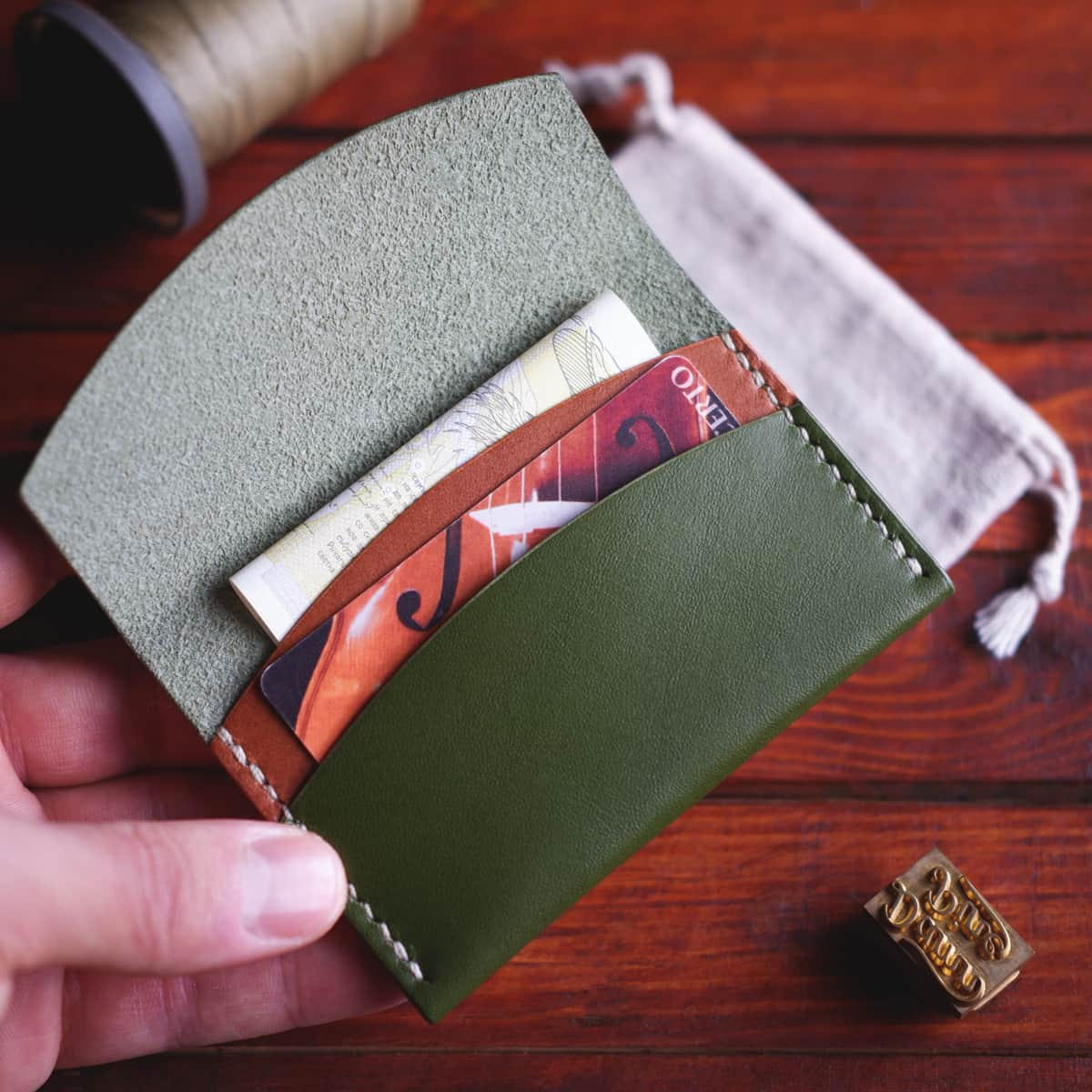 The Mountain Card Wallet in Koala leather - interior view with cards and half folded banknotes