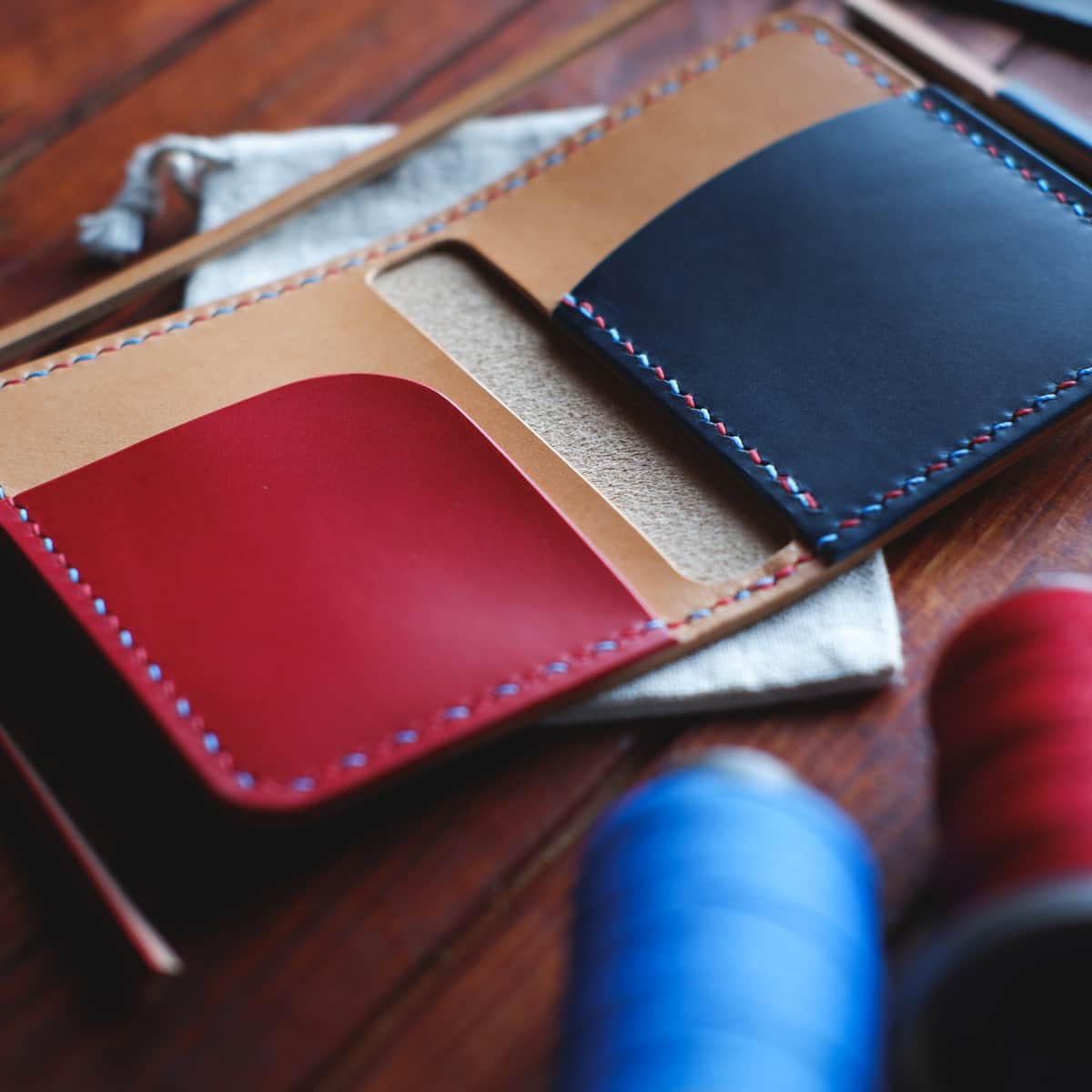 Interior of The Mountain Bifold wallet in Biscuit/Natural/Red/Blue Buttero full grain vegetable tanned leather