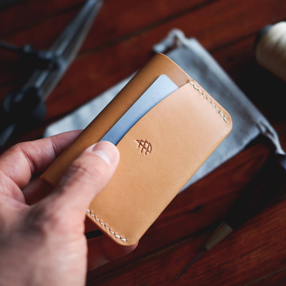 The Mountain Snap Wallet in Natural/Biscuit Buttero vegetable tanned leather - back side with quick draw pocket and credit card inserted