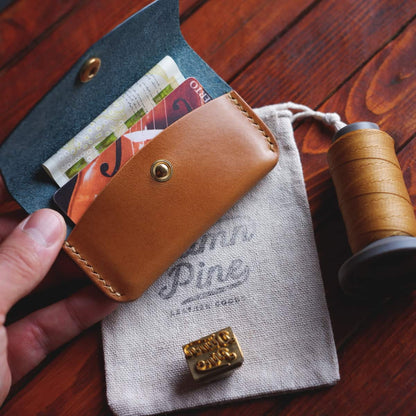 The Mountain Snap Wallet interior pictured with cards and cash