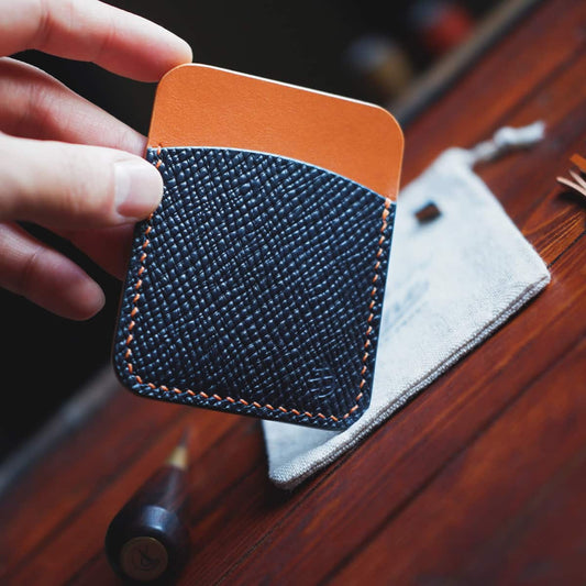 The Palm Card Holder in Blue Buttero Hatch and Orange Koala vegetable tanned leathers