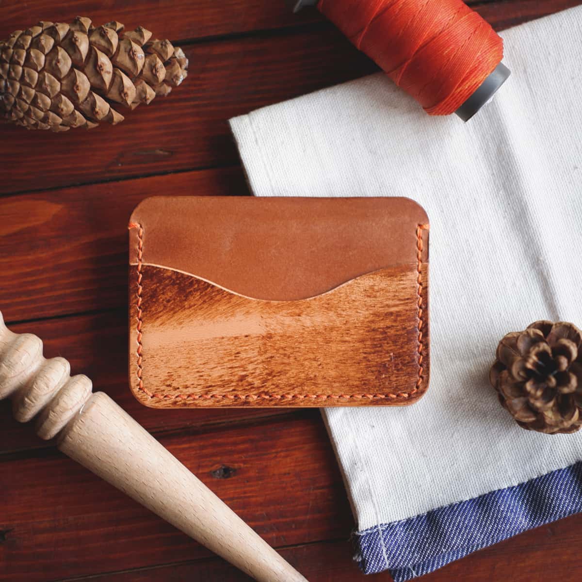 Tabletop view of The Pinyon Card Holder in Brown Appaloosa and Whiskey Maya vegetable tanned leather