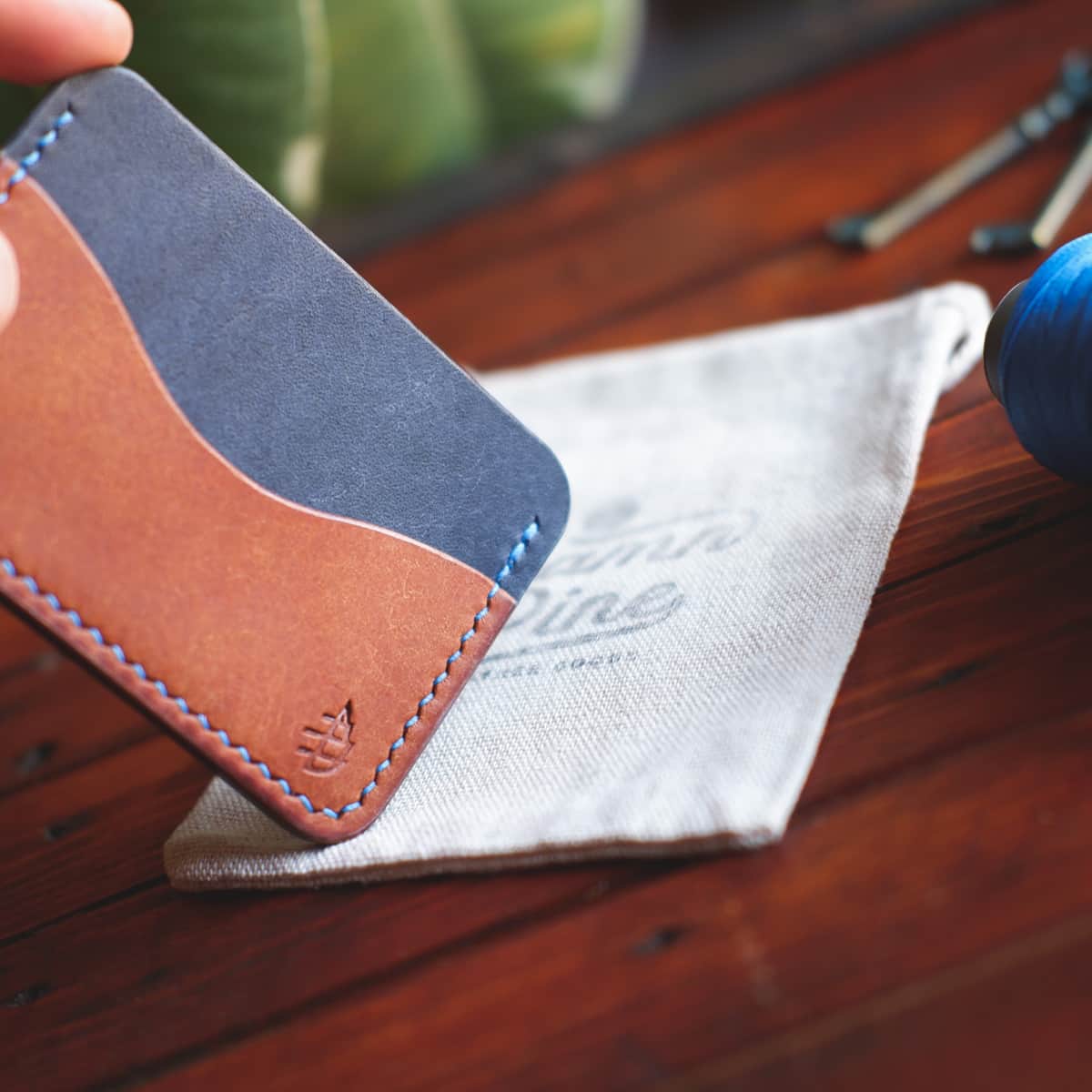 Closeup of The Pinyon Card Holder in Navy and Brown Margotta leather