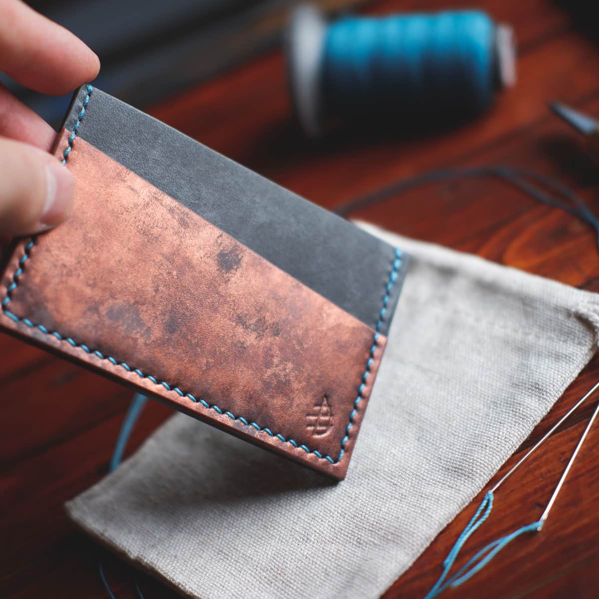 Closeup of The Scots Card Holder in Rame Bisanzio and Charcoal Maya vegetable tanned leather